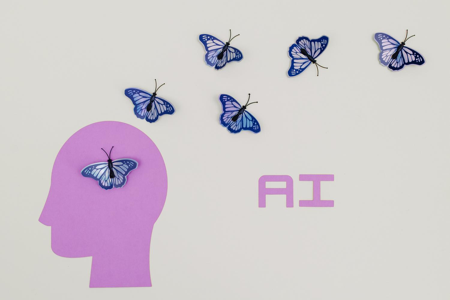 Ilustración surrealista de mariposas emergiendo de la silueta de una cabeza humana, simbolizando la abundancia cognitiva y el giro filosófico de la mente humana con la IA. Ilustración surrealista de mariposas emergiendo de la silueta de una cabeza humana, simbolizando la abundancia cognitiva y el giro filosófico de la mente humana con la IA.