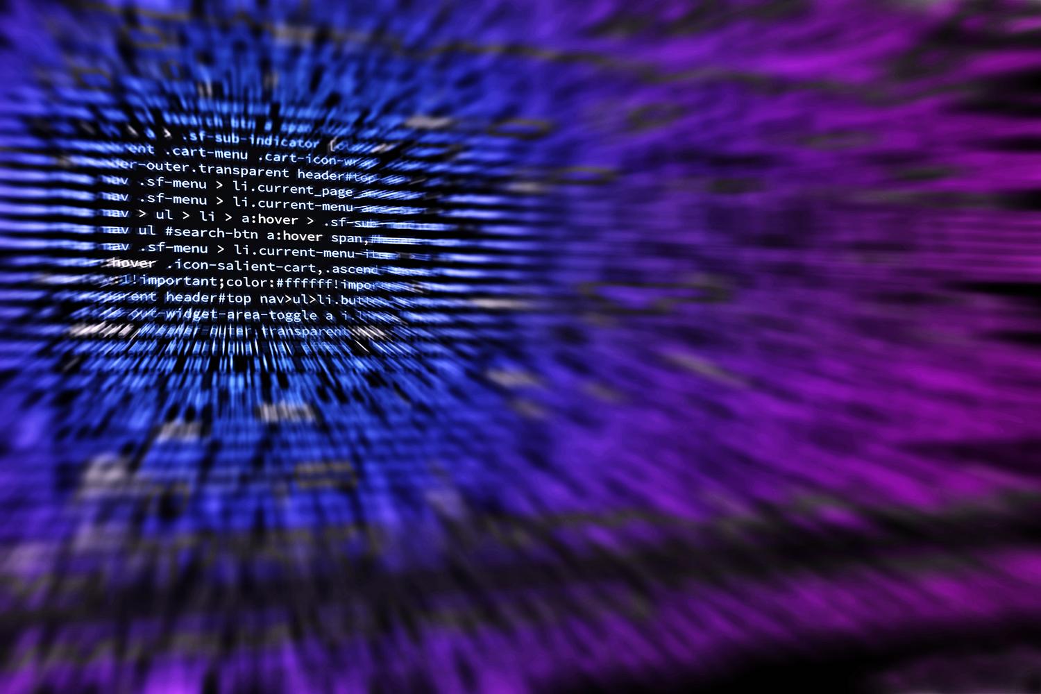 Fondo abstracto con código de programación distorsionado con un efecto de desenfoque radial, representando la naturaleza caótica de los lenguajes esotéricos. Fondo abstracto con código de programación distorsionado con un efecto de desenfoque radial, representando la naturaleza caótica de los lenguajes esotéricos.